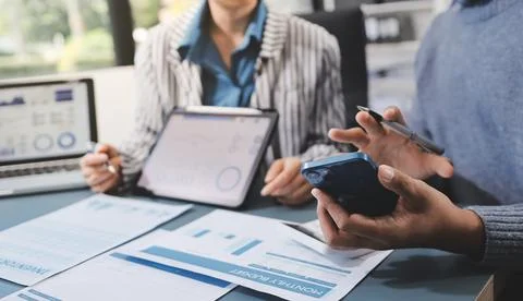 Business professional analyzing financial data on digital tablet dashboard .. Stock Photos