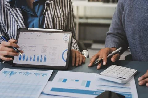 Business professional analyzing financial data on digital tablet dashboard .. Stock Photos