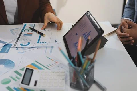 Business professional analyzing financial data on digital tablet dashboard .. Stock Photos