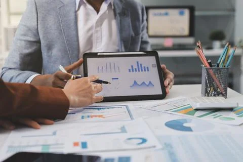 Business professional analyzing financial data on digital tablet dashboard .. Stock Photos
