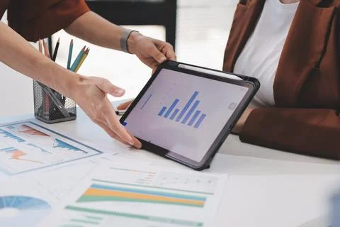 Business professional analyzing financial data on digital tablet dashboard .. Stock Photos