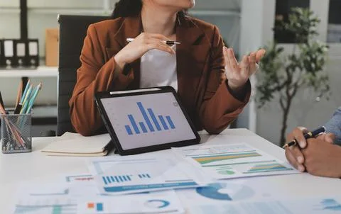 Business professional analyzing financial data on digital tablet dashboard .. Stock Photos
