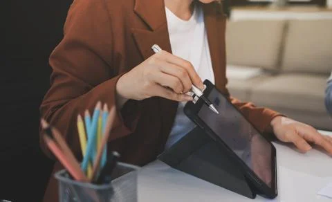 Business professional analyzing financial data on digital tablet dashboard .. Stock Photos