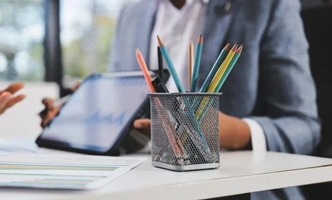 Business professional analyzing financial data on digital tablet dashboard .. Stock Photos