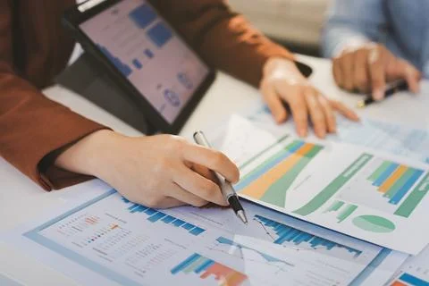 Business professional analyzing financial data on digital tablet dashboard .. Stock Photos