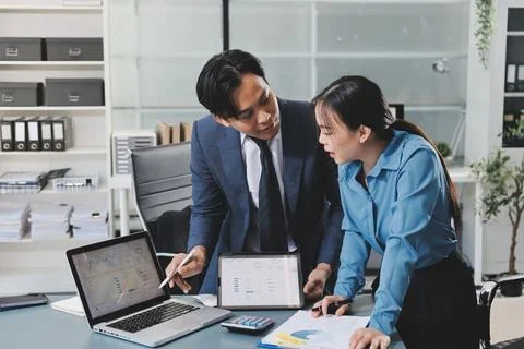 Business professional analyzing financial data on digital tablet dashboard .. Stock Photos