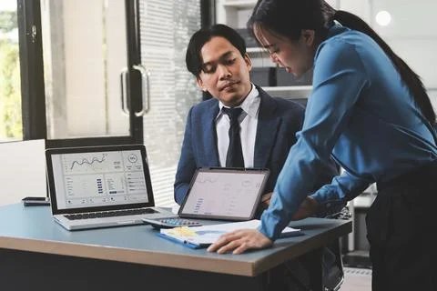 Business professional analyzing financial data on digital tablet dashboard .. Stock Photos