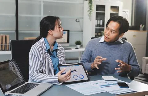 Business professional analyzing financial data on digital tablet dashboard .. Stock Photos