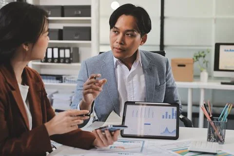 Business professional analyzing financial data on digital tablet dashboard .. Stock Photos