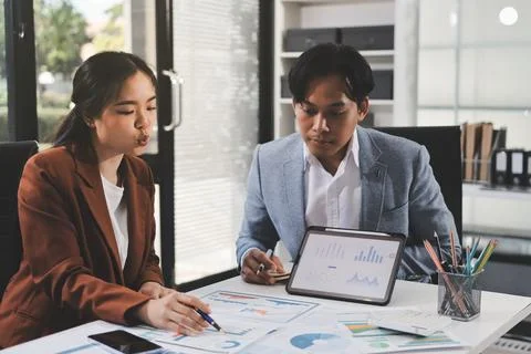 Business professional analyzing financial data on digital tablet dashboard .. Stock Photos