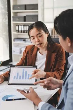 Business professional analyzing financial data on digital tablet dashboard .. Stock Photos