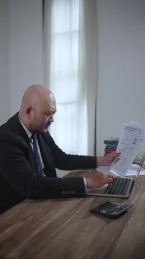 Business Professional Analyzing Financial Documents Stock Footage 336870498