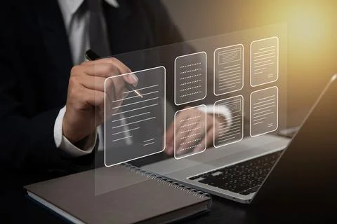 Business professional interacting with a digital interface of document mana.. Stock Photos