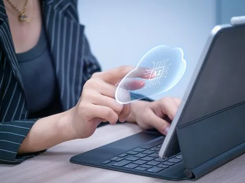 Business professional interacts with cloud-based AI interface on digital de.. Фото
