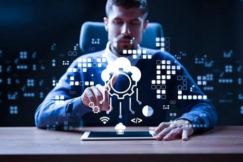 Business professional interacts with software on tablet in modern office setting Stock Photos