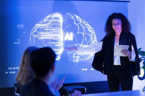 Business professional presents artificial intelligence concepts in a modern.. Stock Photos