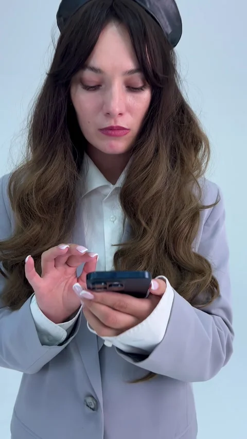 A business professional is skillfully using a smartphone in a modern Stock Footage 307486595