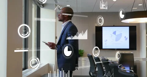 Business professional tapping tablet at window, reviewing analytics with AR data 動画素材 310864299