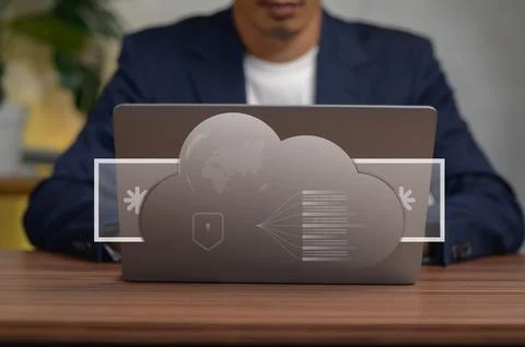 Business Professional Using Cloud Computing Technology on Laptop in Office .. Fotos Stock