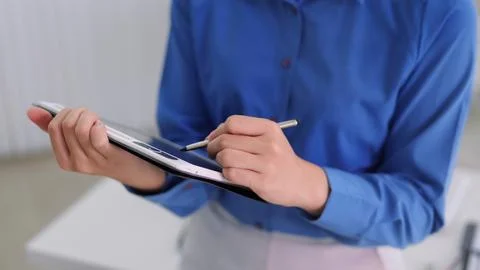 Business professional using digital tablet with stylus pen for work plannin.. Stock Photos