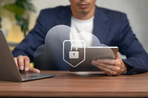 Business Professional Using Digital Tablet and Laptop at Office Desk Stock Photos