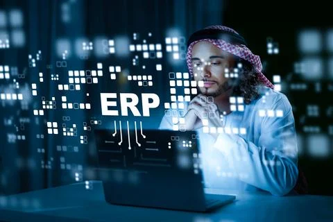 Business professional using ERP software on laptop in an office setting Stock Photos