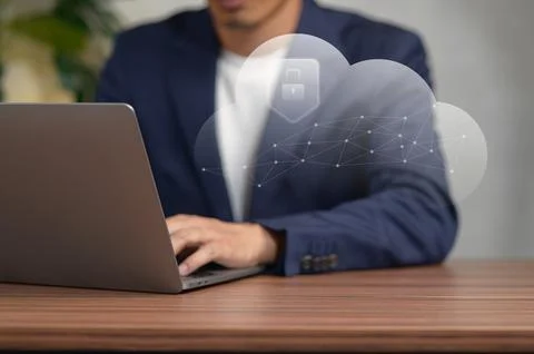 Business Professional Using Laptop with Cloud Technology Visualization in O.. Stock Photos