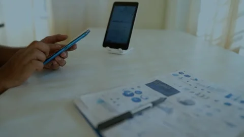 Business Professional Using Smartphone and Tablet Stock Footage 320725302