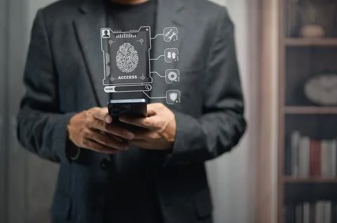 Business Professional Using Smartphone with Digital Security and Access Icons 写真素材