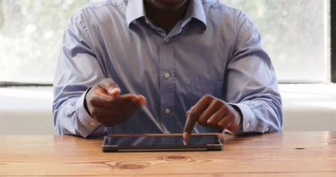Business professional using tablet at office desk, focusing on digital tasks Stock Footage 346220263