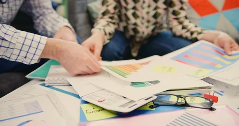 Business Professionals Analyzing Financial Data At Desk In Office 4K Stock Footage 92433161