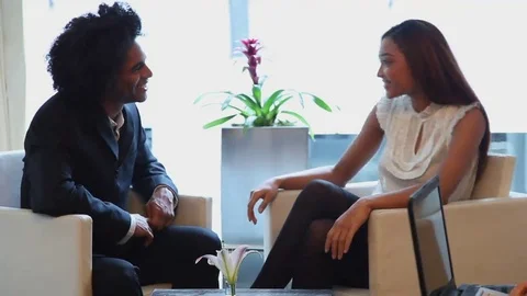 Business professionals conducting interview in lobby Stock Footage 69185848