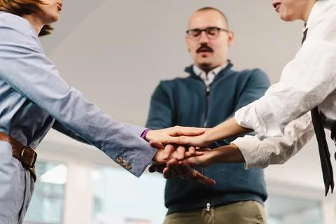 Business professionals engage in teamwork exercise to build collaboration Stock Photos