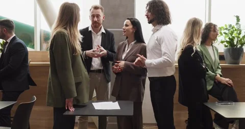 Business professionals networking during office event discussing partnership Stock Footage 341709400