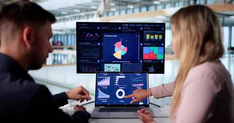 Business Professionals Utilizing Data Analytics To Analyze Market Trends. Stock Photos