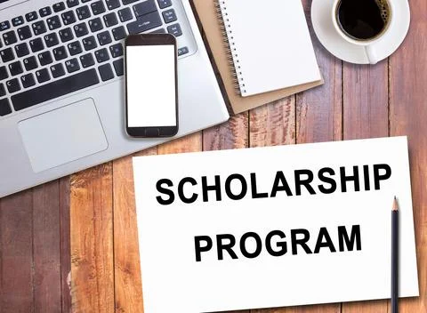 Business quotes, SCHOLARSHIP PROGRAM on notebook or paper in office desk, o.. Stock Photos
