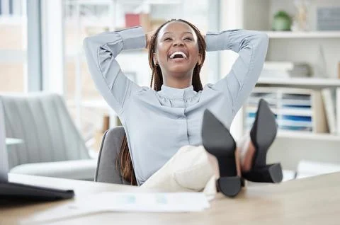 Business, relax and black woman with feet on a desk, smile or achievement with Stock Photos