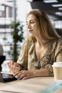 Business sales manager at work finalizes strategy planning in her office Stock Photos