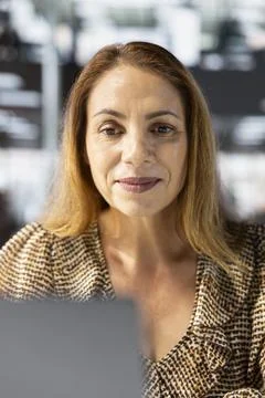 Business sales manager at work finalizes strategy planning in her office Stock Photos
