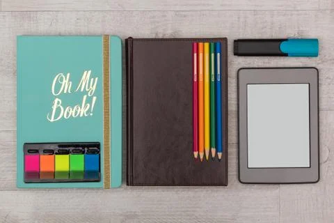 Business set: diary, an e-book with crayons and marker Stock Photos
