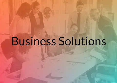 Business solutions text and gradient overlay against business people working at 库存照片