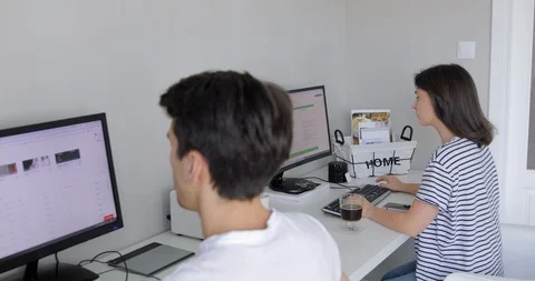 Business spouse colleagues analyzing documents and using living room as office. Stock Footage 127387161