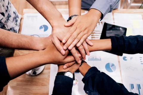 Business startup Teamwork joining hands team spirit Collaboration Concept Stock Photos