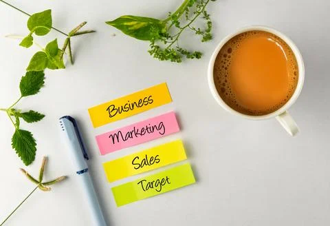 Business Strategy Notes With a Cup of Tea on Desk Stock Photos