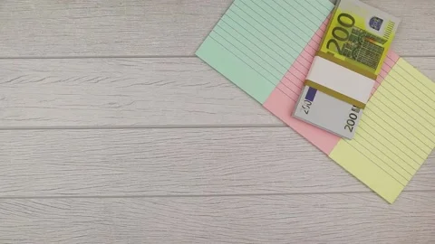 Business success concept with notes and 200 euro banknotes. Stop motion Stock Footage