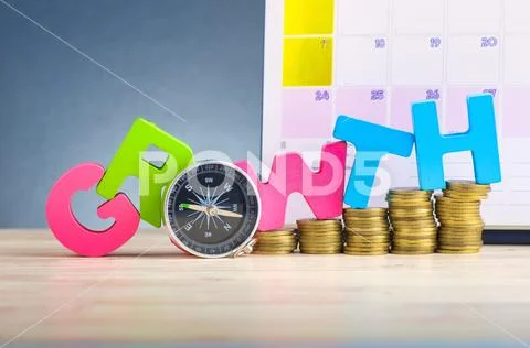 Business success concept, stacking coins and word GROWTH on wooden desk over Stock Photos