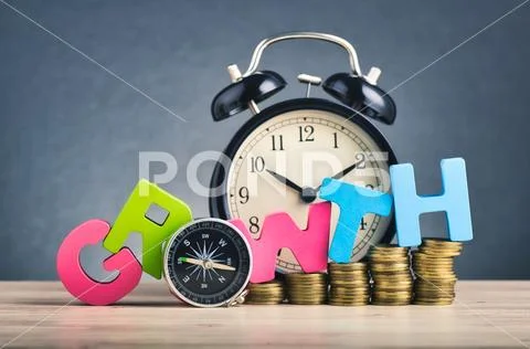 Business success concept, stacking coins and word GROWTH on wooden desk over Stock Photos