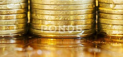 Business success - golden coins close-up Stock Photos