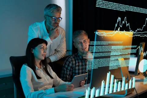 Business Team Analyzing Data On Computer With Graphs And Charts Foto stock