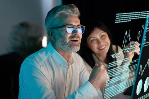 Business Team Analyzing Data On Computer Screen in Office 写真素材